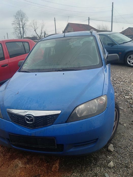 Vand mazda 2 capacitate motor 14