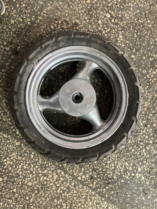 Janta  scuter spate cu cauciuc   130/70-12 61j