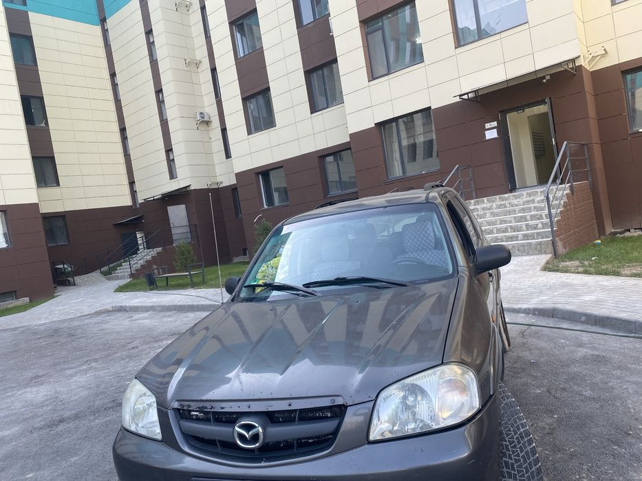 Мазда Трибют