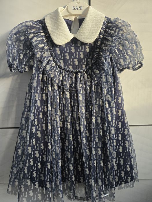 Платье Dior и костюм Balmain