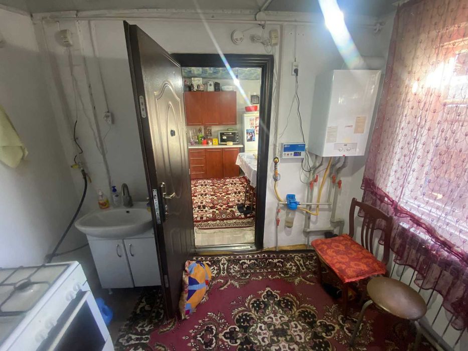 Дом на Бугре, Танат Империя