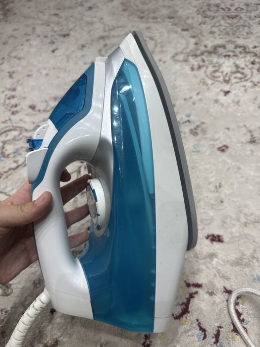 Гладильная доска с утюгом