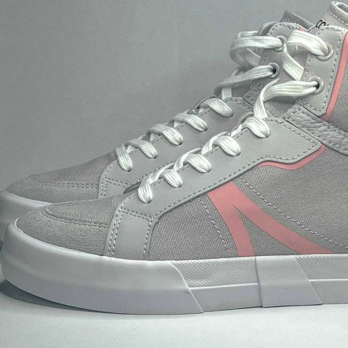 Женские кеды от бренда Lacoste