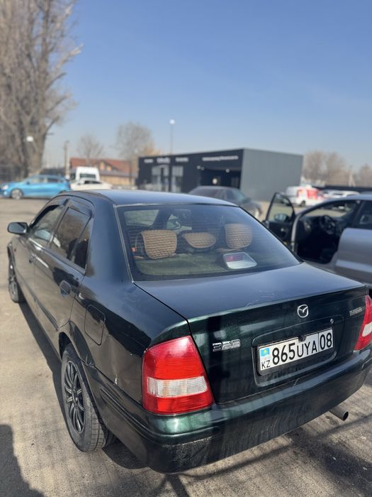 Мазда 323  кандёрмен