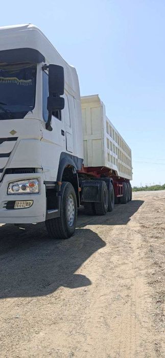 HOWO ТЯГАЧ заводской газ с прицепом  грузоплдъёмность 60 тонна