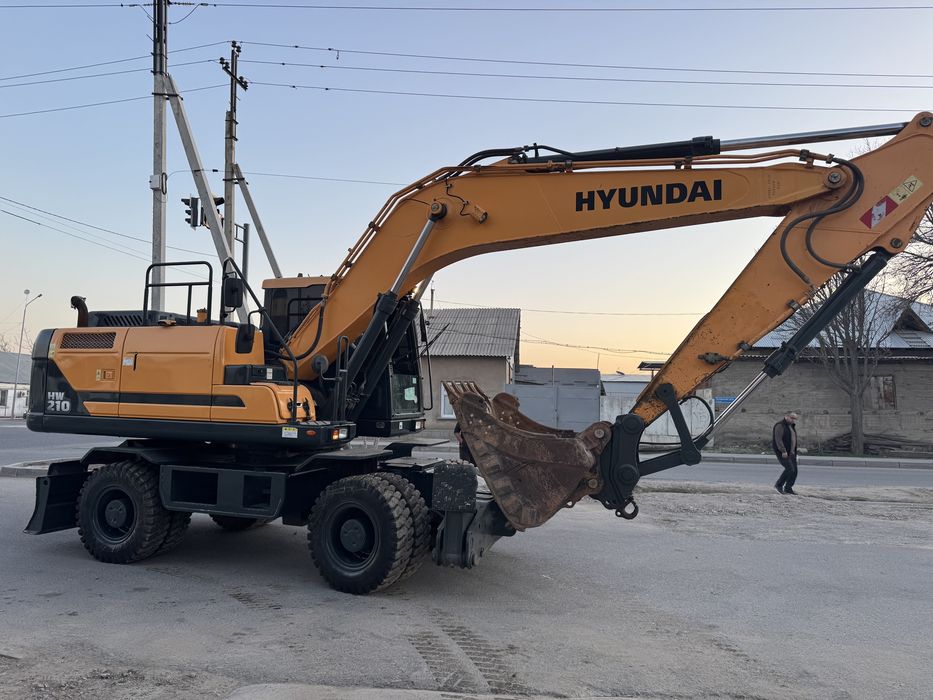Услуги экскаватора колесного 210