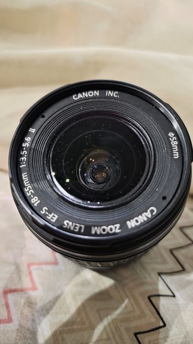 Объектив Canon вспышка Nikon