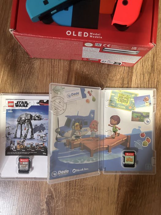 Nintendo Switch OLED + 2 jocuri + cutie + accesorii