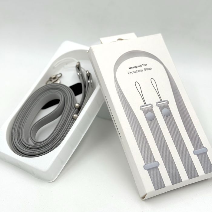 Промо пакет: Връзка Crossbody Strap + Силиконов калъф с лого за iPhone 12/13/14/15/16/17 Plus, Air, Pro и Pro Max