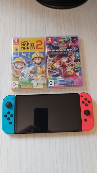 Consola Nintendo Switch OLED - pachet complet + 2 jocuri la alegere