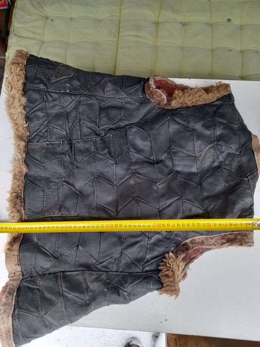 Кожен елек и кълпак