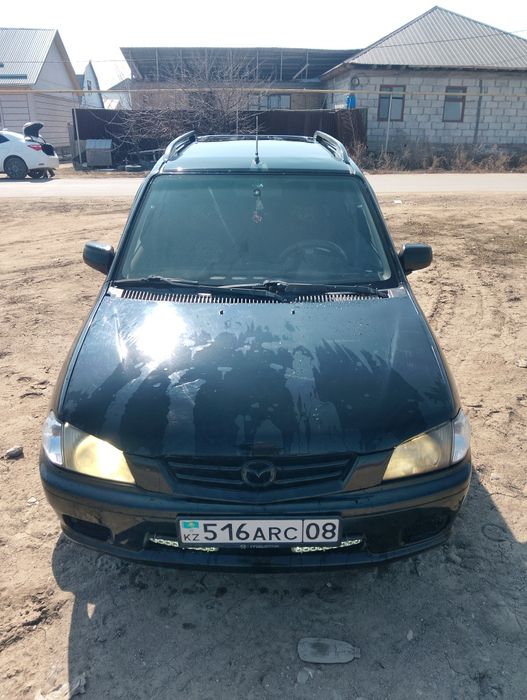 Мазда демио 2003 года
