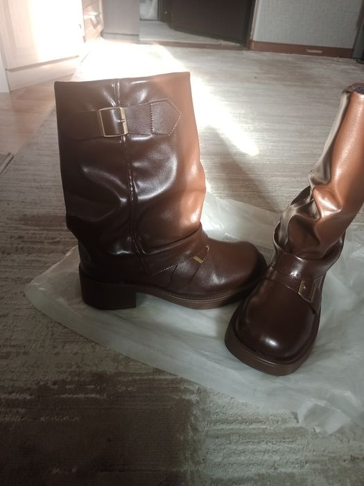 Продам сапоги новые