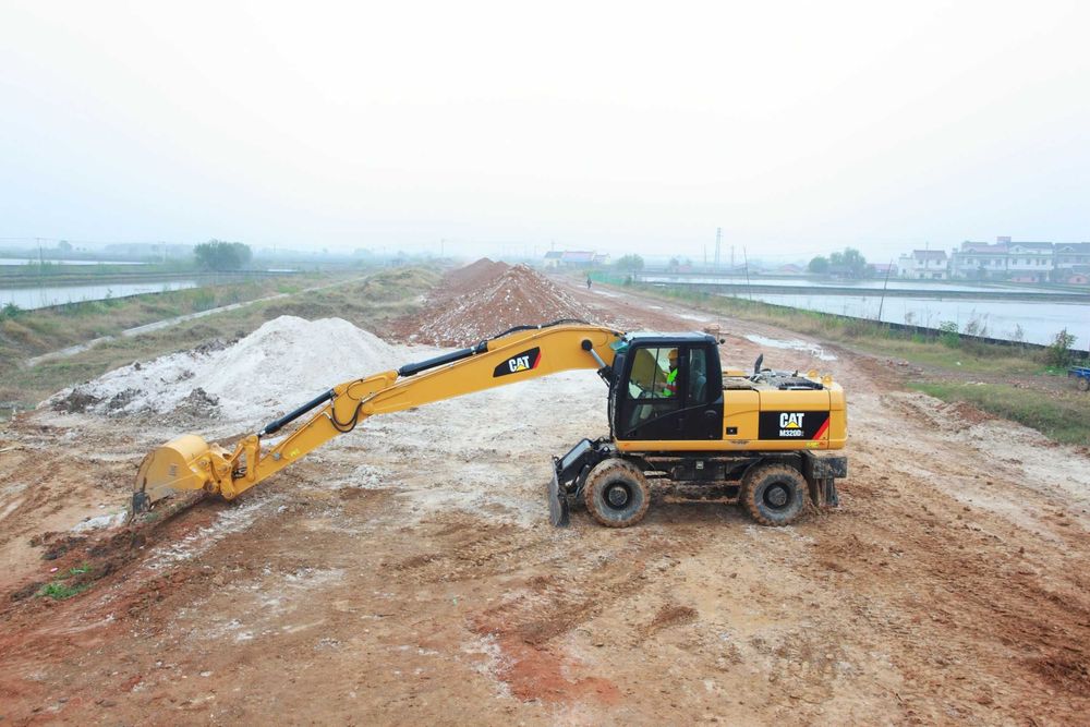 Колесный экскаватор CAT [M320] 1.19м³