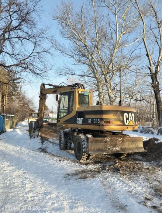 Продам колесный экскаватор Caterpillar M315, 2001 г.