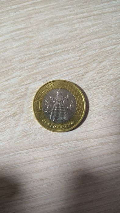 Монета номиналом 100 тг