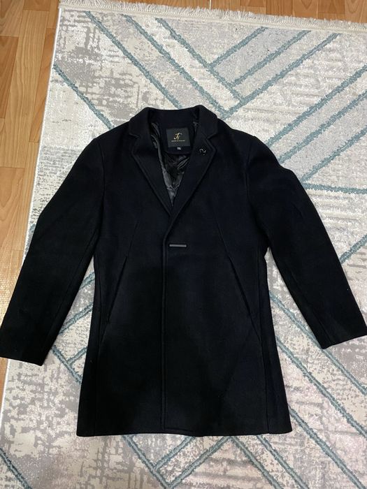 Продам мужское пальто новый.