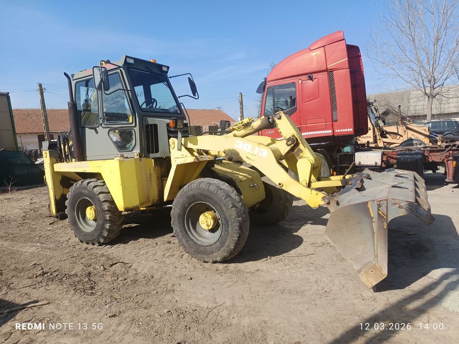 Buldoexcavator.inarcator frontal