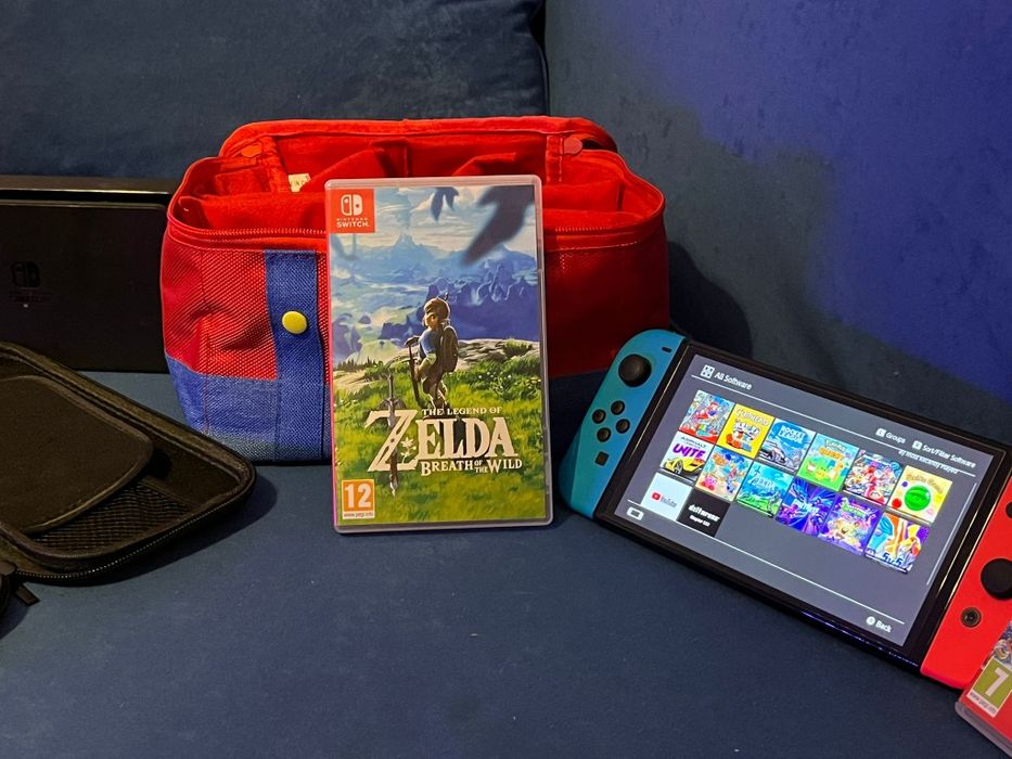 Nintendo switch + 12 jocuri incluse Zelda Mario, accesorii