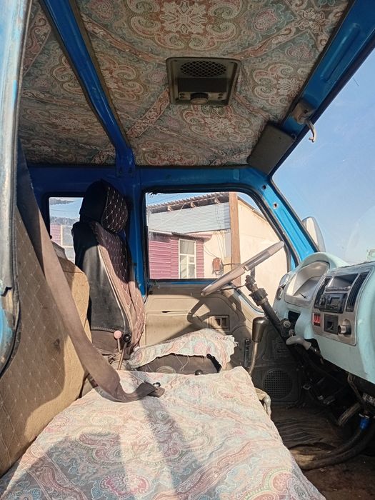 Жүкті өзі түсретін машина