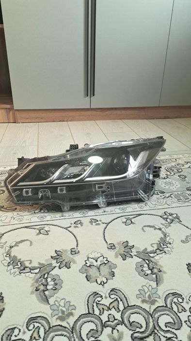 Toyota Corolla фара e210