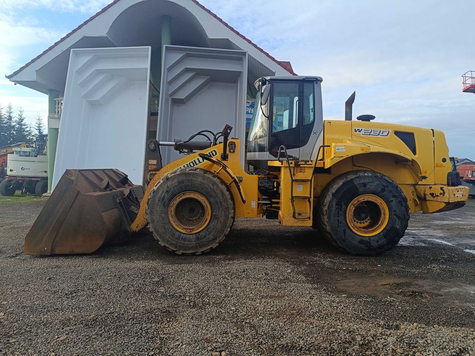 Încărcător frontal NEW HOLLAND W231, 22 tone, 2006