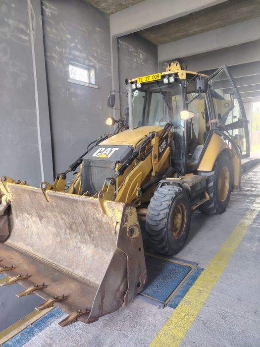 Vând buldoexcavator Caterpillar