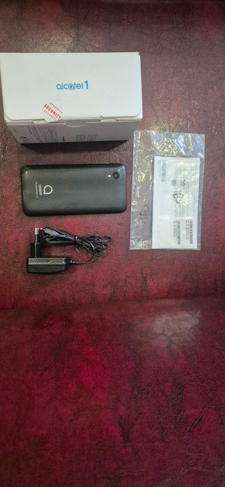 Телефон Alcatel one