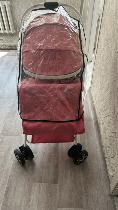 Продам коляску розовую