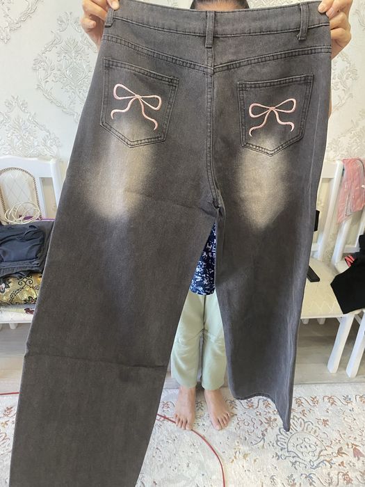 джинсы новые с бантиком черные