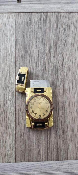 Продам зажигалку с часами 2000