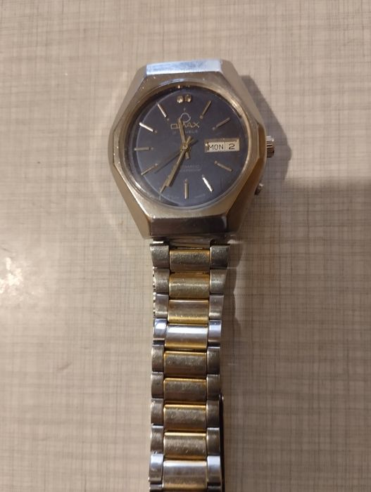 Часы омакс швейцарские механические70 годов