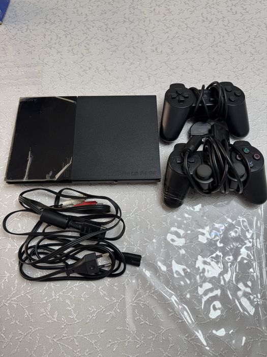 PlayStation 2 Slim yangidek holatda