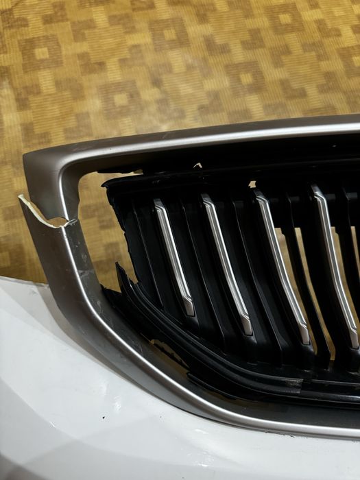 Передний бампер  на Geely Emgrand