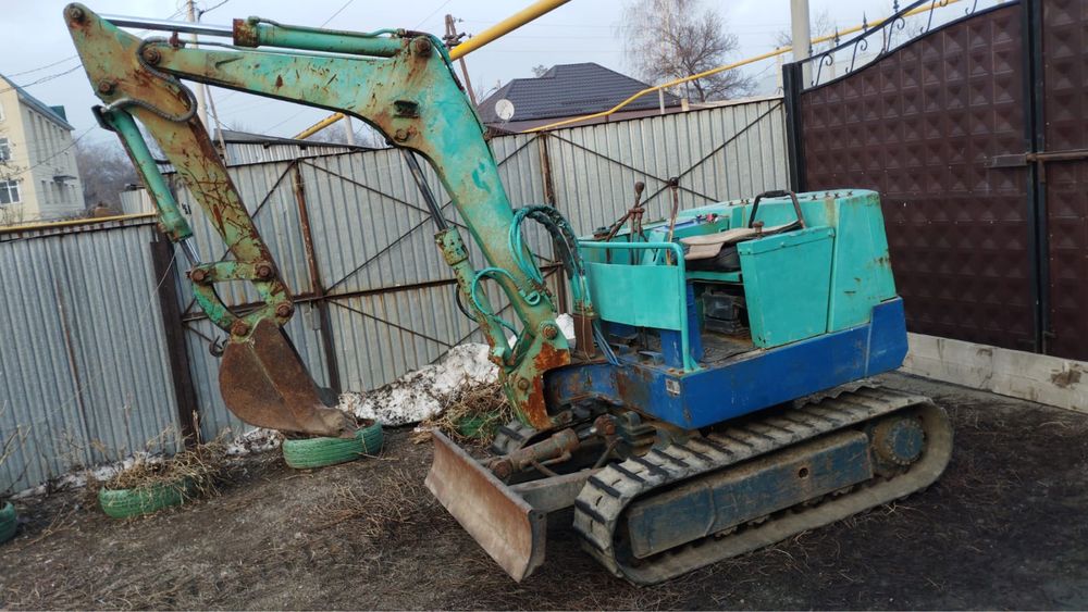 Японский миниэкскаватор Takeuchi TB