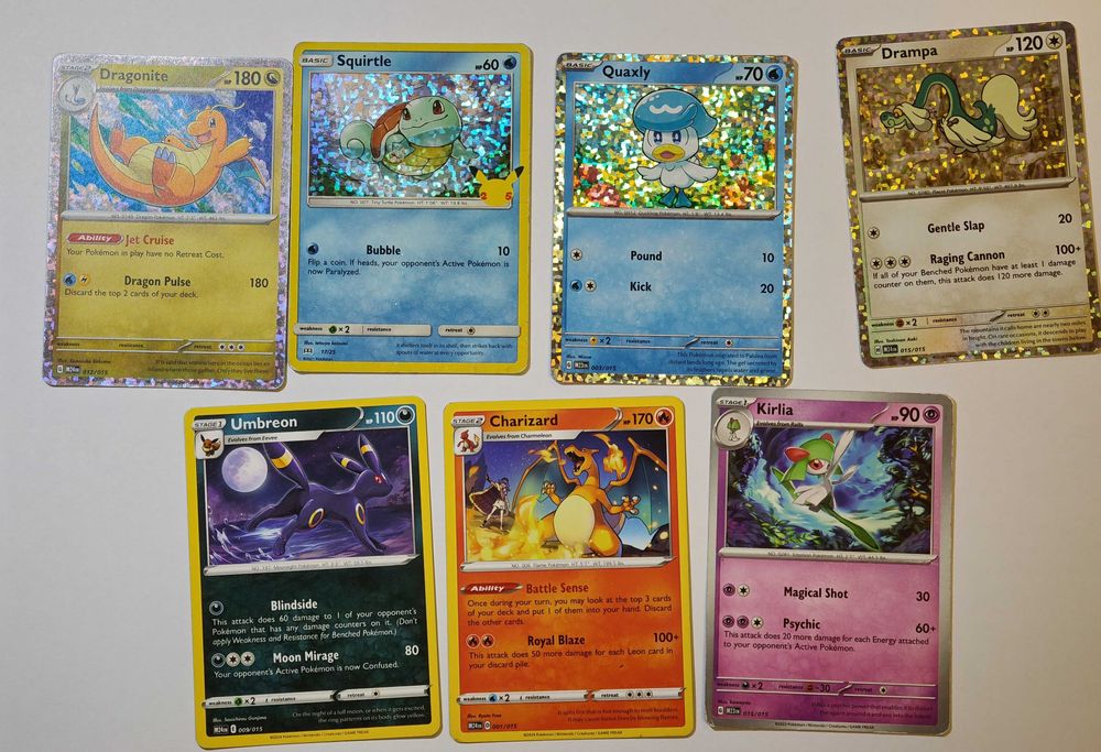 Lot 19 Pokémon Cards - Charizard, Squirtle Holo, Dragonite, Umbreon