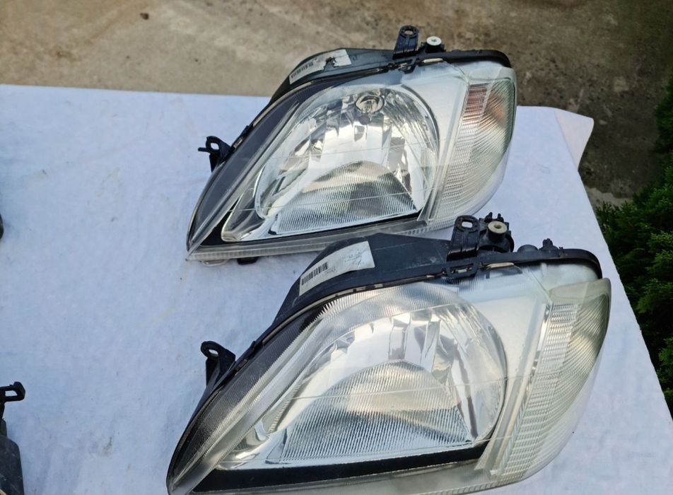 Faruri logan originale Elba (faza 1 ) și lampă spate