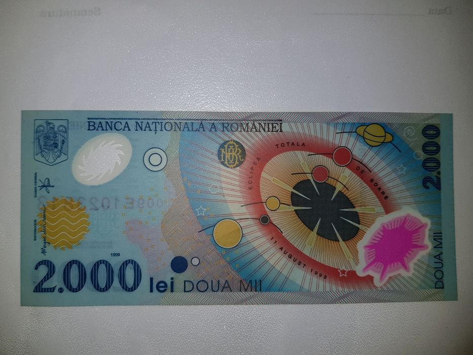 Bancnota 2000 lei eclipsa de soare și moneda 500 lei