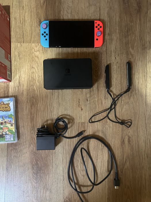 Nintendo Switch OLED + 2 jocuri + cutie + accesorii