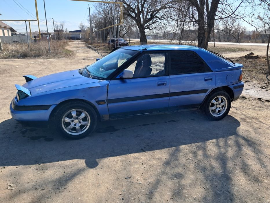 Машина мазда 323