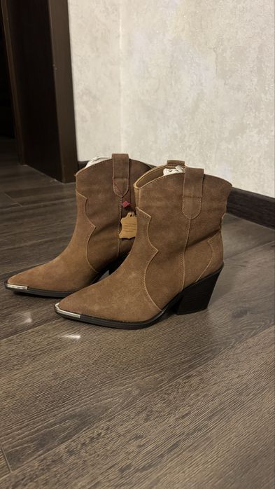 Продам новые сапоги