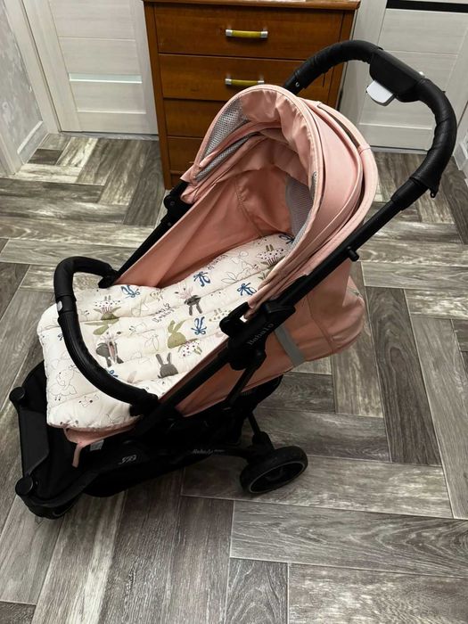 Коляска для девочки розовая