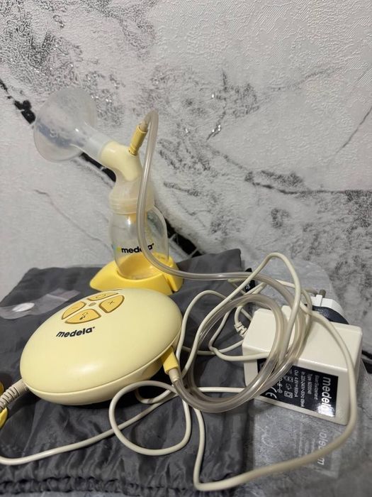 Молокоотсос medela  электрический