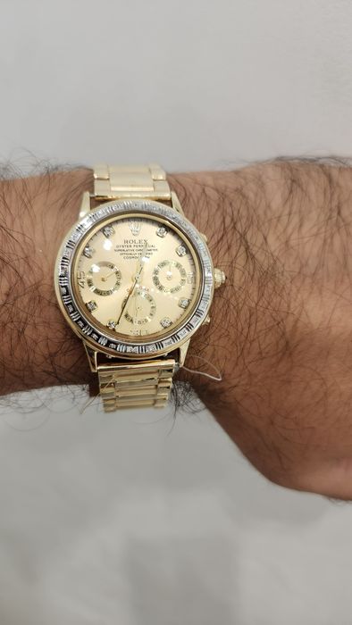 Женские золотые часы Rolex.