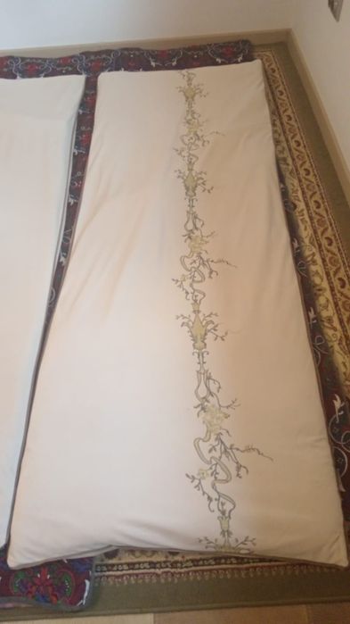 Көрпелер мактамен сырылған