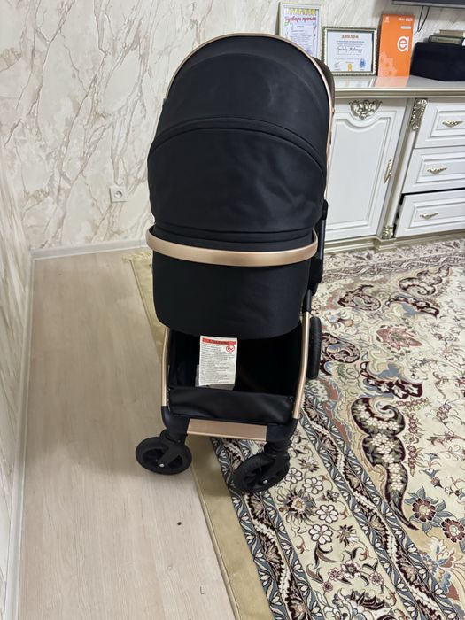 Kidilo brendiga oid bolalar kolyaskasi sotiladi.