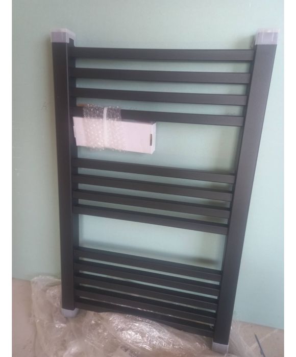 Черный полотенцесушитель новый
