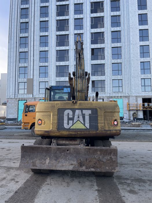 Продам колесный эксковатор CAT318