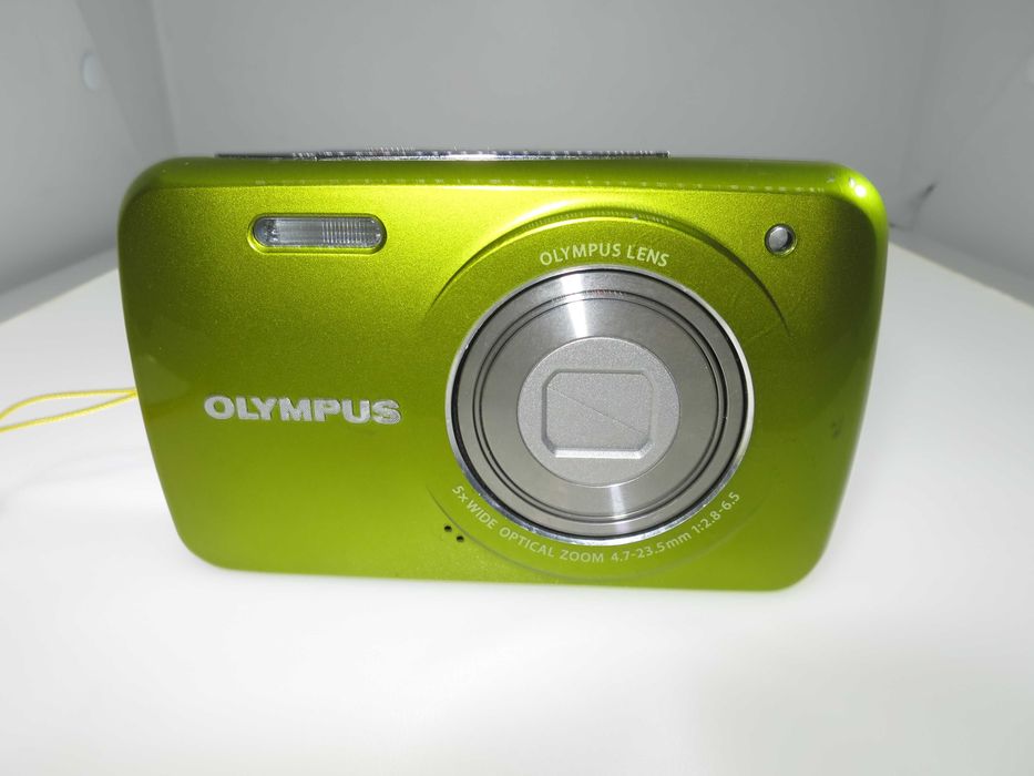 Olympus VH 210 ултра компактен фотоапарат в страхотен свеж зелен цвят и състояние като НОВО, тестван и работи отлично, пълен комплект