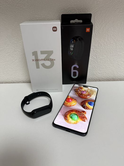 Продам смартфон XIAOMI 13 Lite в подарок смарчасы XIAOMI Mi Smart Band